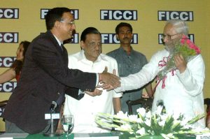 Felicitating CM at a FICCI meet