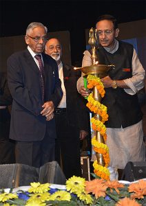 Lighting the lamp at a school centenary with the Governor of West Bengal