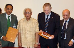 Kumar signing an MOU in Italy